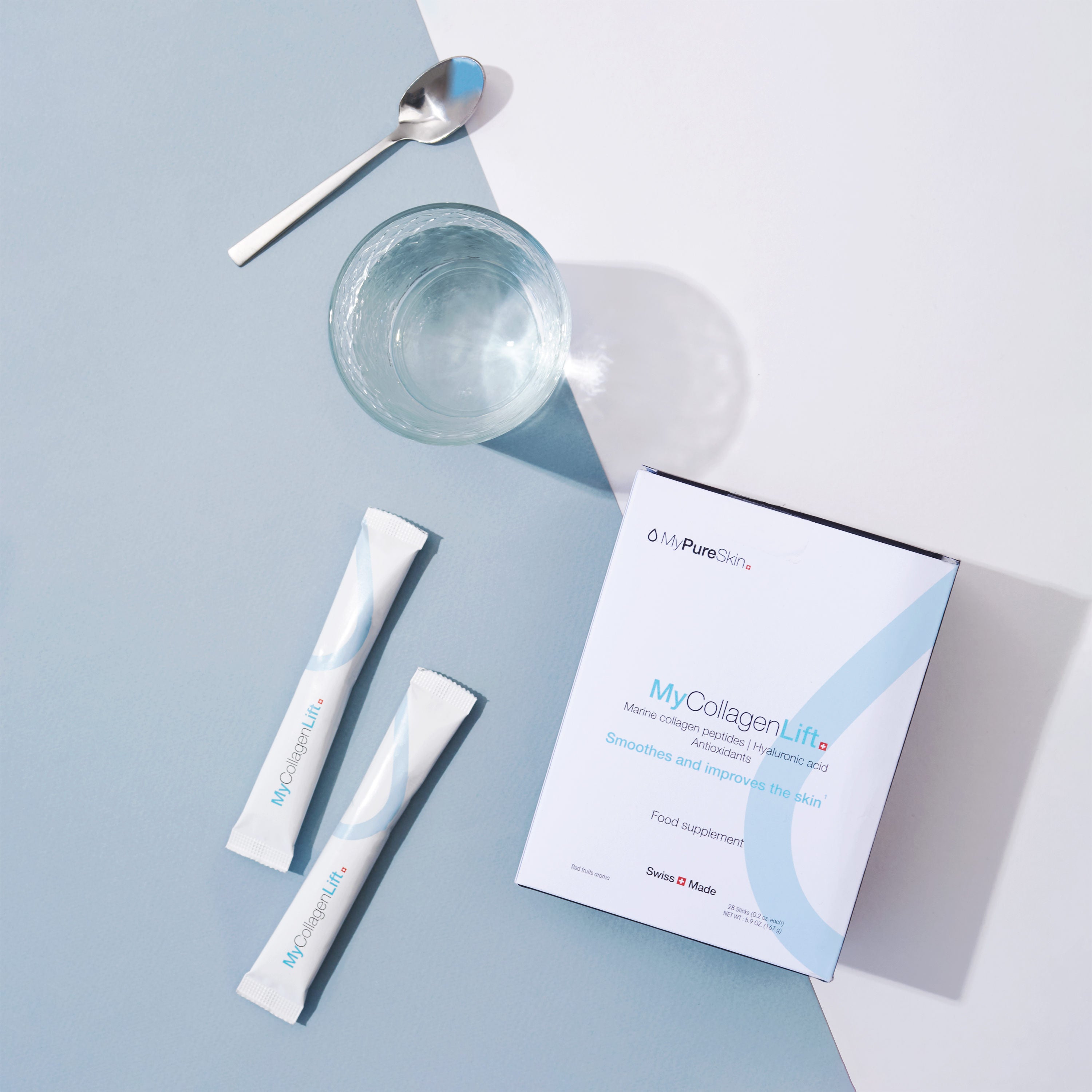 MyCollagenLift box with two collagen sticks, a glass of water and a spoon