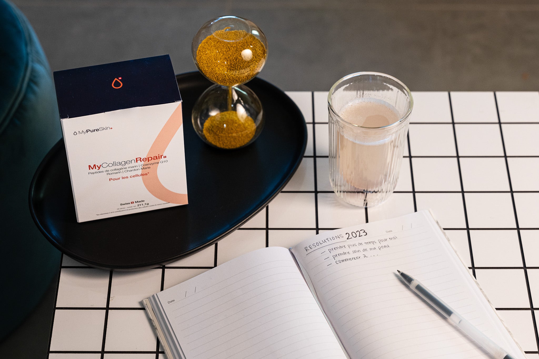MyCollagenRepair drink on a table next to a diary